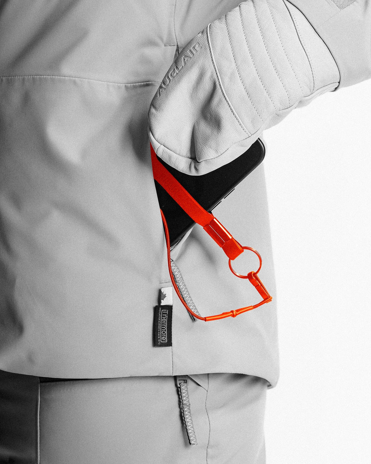 Insulated media pocket with phone leash