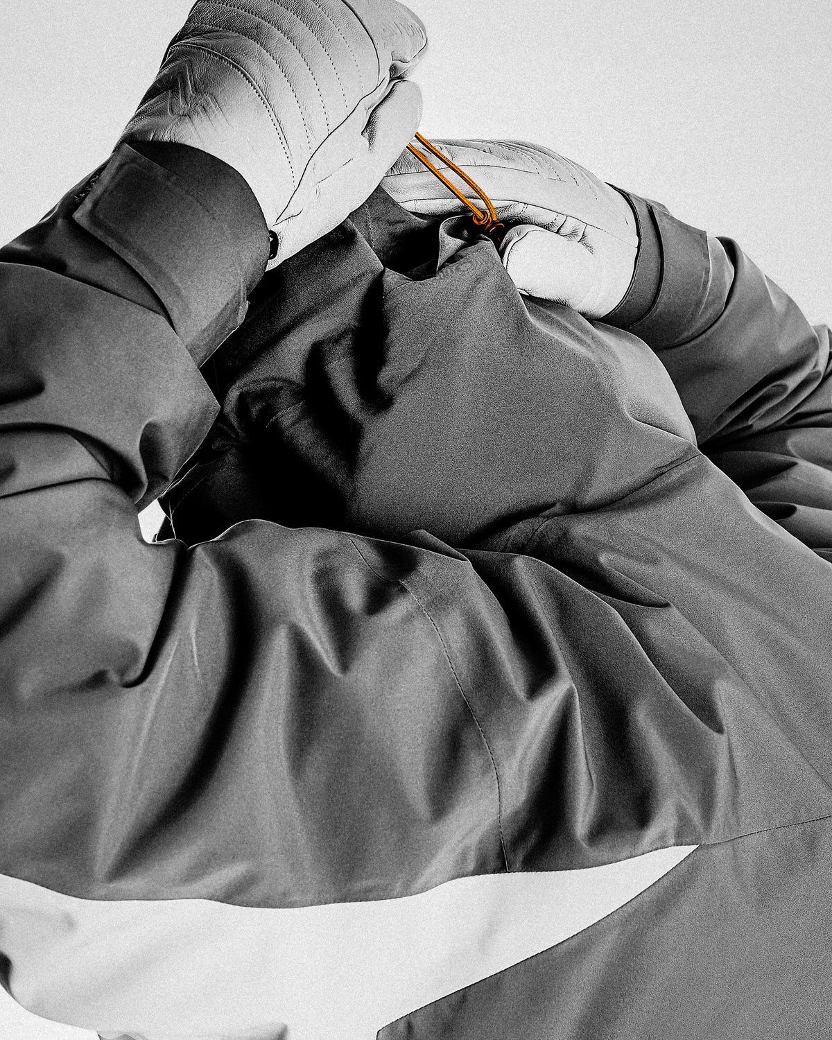 Helmet-compatible hood with two-way adjustment